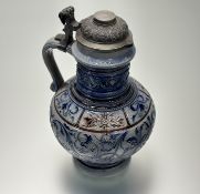 A German Westerwald salt-glazed stoneware highly deorated jug with pewter cover. (marked 198 B