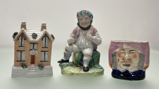 A collection of 19thc Staffordshire comprising, a victorian Staffordshire Money Box in the form of a