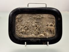 A carved stone relief plaque depicting, a Folklore setting of musicians playing under a tree with