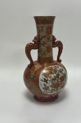 A Japanese Kutani porcelain vase, with traditional scenes to body and shaped dragon twin handles