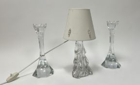 A pair of faceted glass candlesticks of fluted form, with petal cut glass tops (h. 25cm), together