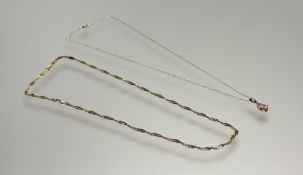 A 9ct gold spiral flat link chain necklace with ring fastening: l. x 22cm 5.37g and a 9ct gold