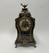 A 19thc French boulle Ormolu mounted tourtoiseshell clock in the Louis XVI style, with enamelled