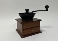 An Old Thompson coffee mill, cast iron and wooden with pull-out drawer (h. 22cm)