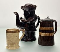 A collected of decorative pottery wares comprising, a lidded pottery jug with a treacle drip glaze