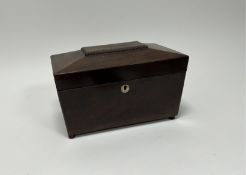 A 19thc mahogany tea caddy with hinge lid revealing fitted interior, with mother of pearl to front