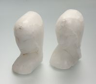 A pair of carved white marble bookends in the form of female face busts. (signs of chips) (h-