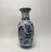 A modern Chinese blue and white hand-painted vase of bulbous form, decorated with birds,