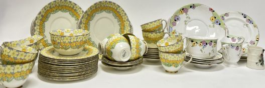 A Royal Doulton tea service in the 'Parma' pattern comprising, two twin-handled cake plates, a sugar