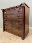 A Victorian mahogany chest of drawers, fitted five graduated long drawers with turned handles,