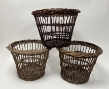 A collection of three woven wooden waste paper bins (h. 29cm) (3)