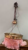 An Edwardian brass light with pink tassel fringe and integral ceiling rose (d. 47.5cm)