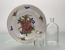 A Mid-Century Kosta Boda decanter with oval circular moulded dog plaque (H116 marked verso) (no