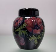A Moorcroft Pottery Anemone pattern lidded ginger jar, marked verso. (h-20.5cm)