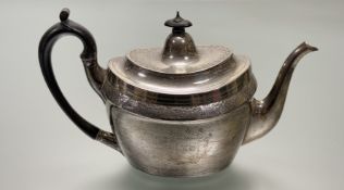 A George III Gustavus Byrne of Dublin silver tea pot of oval form with bright cut and floral