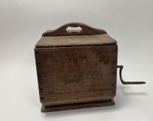 A wooden butter churner with cast iron handle to side and handle to top (h. 40cm)
