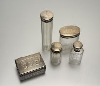 A collection of four London silver-topped panel-sided crystal dressing room jars all with engraved