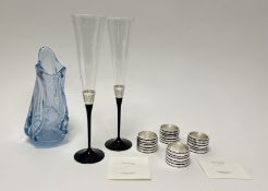 A boxed set of four Vera Wang for Wedgwood silver plate napkin rings with five rings of decorative