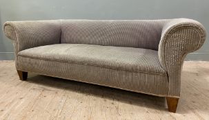 A 20th century Chesterfield sofa, with roll top and arms over upholstered seat covered in a grey