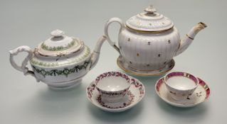 A 19thc porcelain teapot in moulded ribbed form with floral and gilt decoration with flat (staple