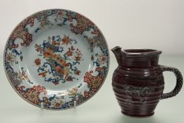An 18thc Chinese Export ware plate, decorated in the Imari Style in polychrome enamelling together