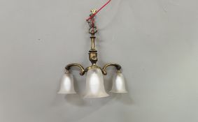 A Mid-Century brass ceiling light, with the three-arms complete with three frosted glass shades of