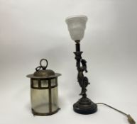 An Art Nouveau moulded resin painted bronze in the form of a mermaid holding a cornucopia with a