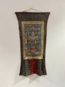 A Burmese Buddhist Thangka silk scroll with silk embroidered mount (l. 98cm x w. 52cm)