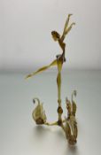 A hand-blown Murano-style glass figurine of a ballerina with three swans to base, in orange with