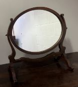 An Edwardian mahogany dressing table mirror of oval form (l. 54cm x h. 52cm)