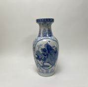 A modern Chinese blue and white hand-painted vase of bulbous form, decorated with peacocks and