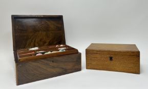 A Victorian rosewood box with inlaid border, with hinged lid revealing two-level compartments with