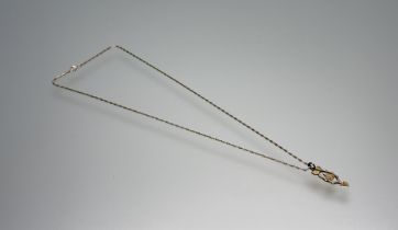 A 9ct gold Welsh spoon pendant on bar link 9ct gold chain necklace with ring fastening: l. x 28cm