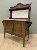 An Edwardian inlaid mahogany washstand, serpentine top with central urn patera over marble