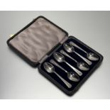 A set of six modern Sheffield silver celtic knot design handled tea spoons in original blue velvet-