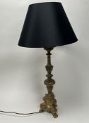 A polished cast brass Altar table lamp in the Rococo style, with moulded scrolls and foliate detail,