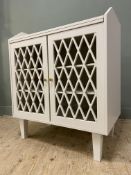A contemporary MDF cabinet, with gallery back over slide and twin lattice style doors to front,