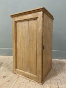 An early 20th century pitch pine tabletop cupboard, with moulded top over inset panel door,