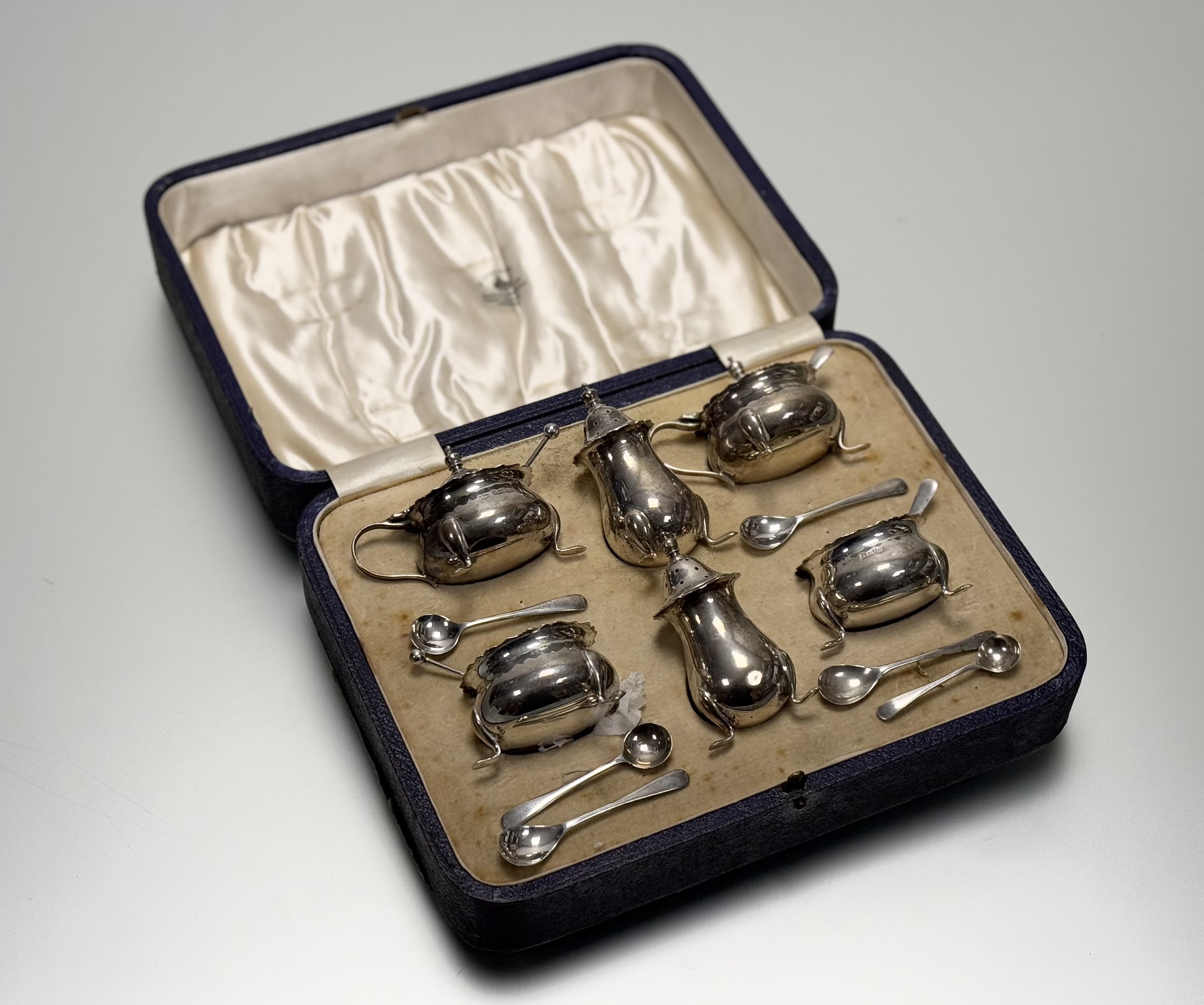 A Mappin & Webb Birmingham silver six-piece condiment set to include a pair of cauldron salt sellers