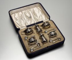 A Mappin & Webb Birmingham silver six-piece condiment set to include a pair of cauldron salt sellers