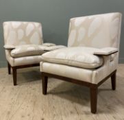 An impressive pair of contemporary armchairs, with straight backs and square arms, upholstered in