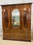 An Edwardian inlaid mahogany three-piece wardrobe, by Francis Smith of Glasgow, the moulded