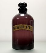 An Early 19thc large purple glass pharmacy bottle with gilded and painted label reading - Tr: Sulph: