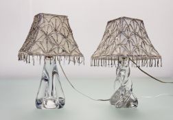 A Serves France twisted clear glass table lamp together with another Serves France clear glass table