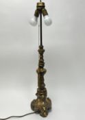 A polished cast brass Altar table lamp in the Rococo style, altar stick later converted to a table