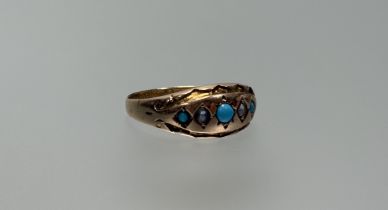 A Chester 9ct gold ring set three graduated turquoise cabouchon beads with two seed pearl spacers