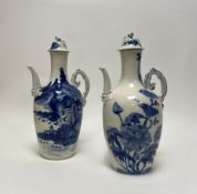 A pair of 19thc Japanese baluster shaped wine jugs and covers in blue and white with shaped