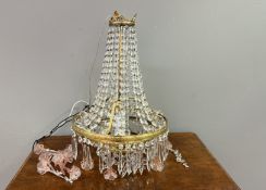 A contemporary cut glass and gilt metal tent and bag chandelier, with strings of faceted cut-glass