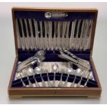 A Viners teak canteen of Sheffield silver flatware suite for eight place settings to include table