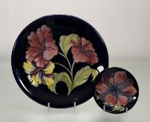 A Moorcroft Pottery anemone pattern trinket dish (w-12cm) together with a Moorcroft Columbine Lily